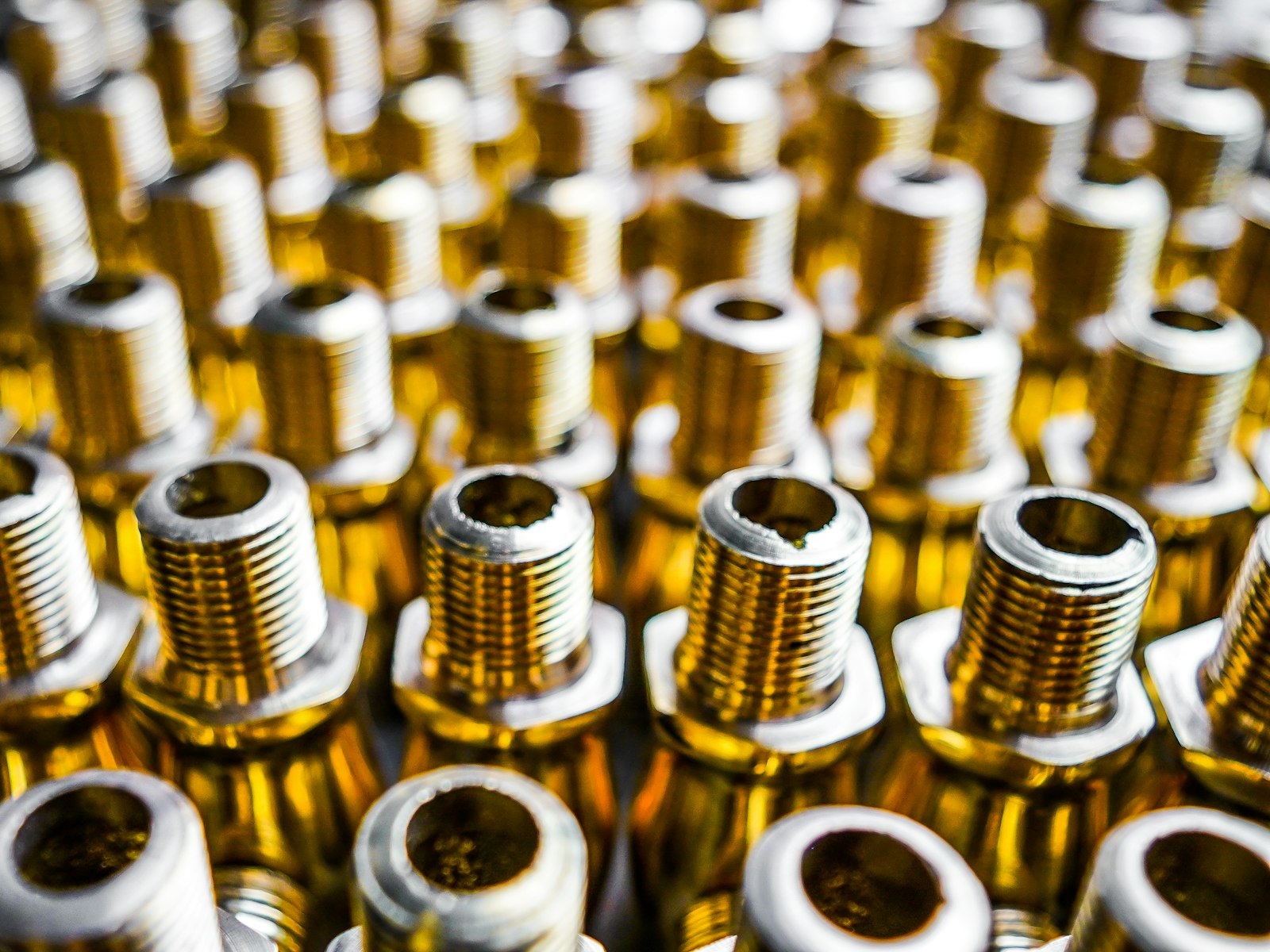 Rows of machined brass adapters