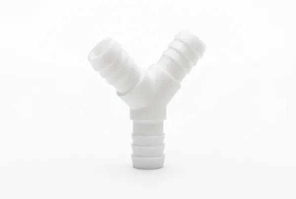 White acetal wye with three hose barbs